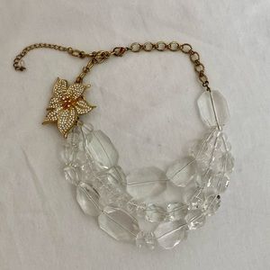 Clear beaded necklace with gold rhinestone flower